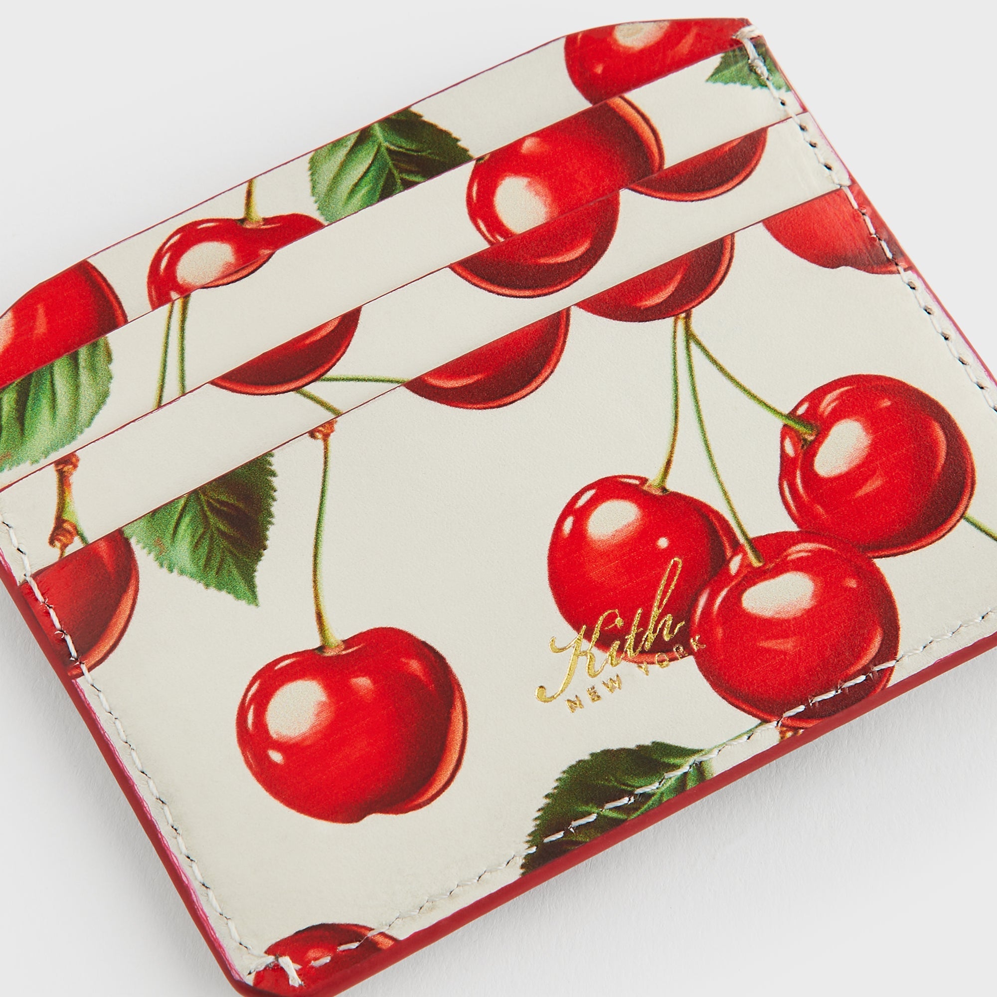 Kith Women Tossed Cherries Notch 6CC Card Case - Sandrift – Kith Japan